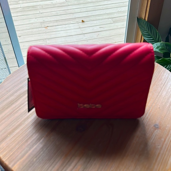bebe Handbags - NWT BeBe crossbody. Red and very beautiful.